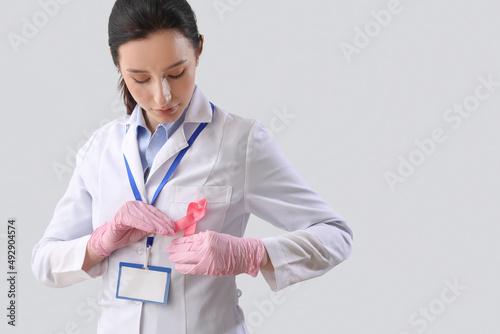 Female oncologist with pink...