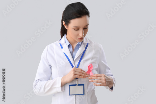 Female oncologist with pink...