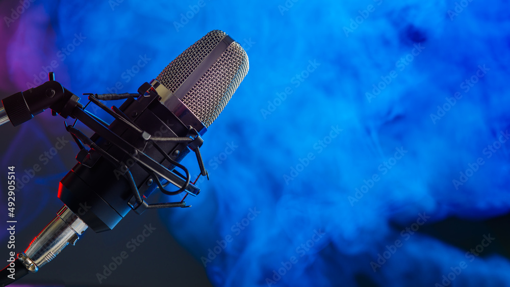 Studio microphone on blue smoke background. Vocal, blogger and sound  recording  for karaoke and recording studio Stock Photo |  Adobe Stock