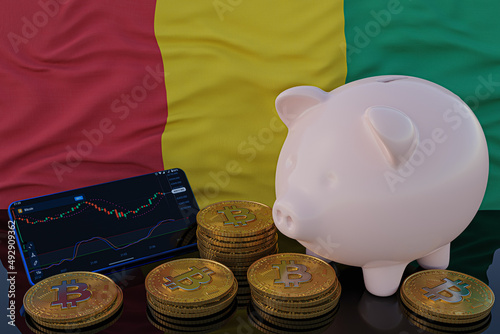 Bitcoin and cryptocurrency investing. Guinea flag in background. Piggy bank, the of saving concept. Mobile application for trading on stock. 3d render illustration.