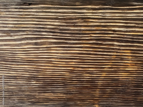 Texture of lines on a dark wooden surface