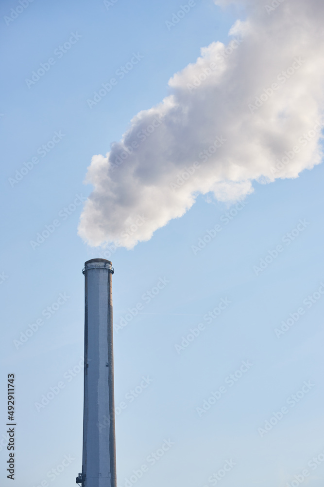 Detail of silo releasing smog into atmosphere Detail of silo releasing smog into atmosphere
