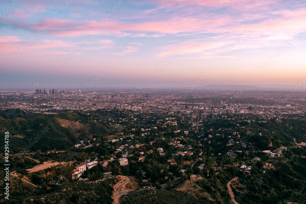 Colorful Sunset over Los Angeles Skyline seen from Griffith Park, California
