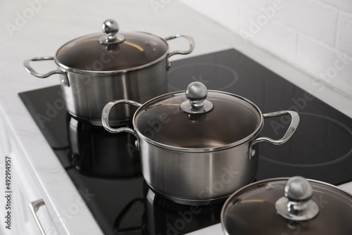 Set of new clean cookware in kitchen