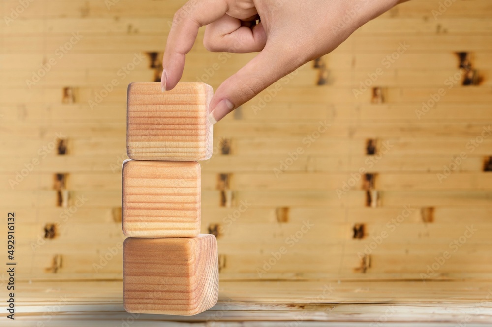 Hand hold wood cube with symbol Business concept. Instructions to ...