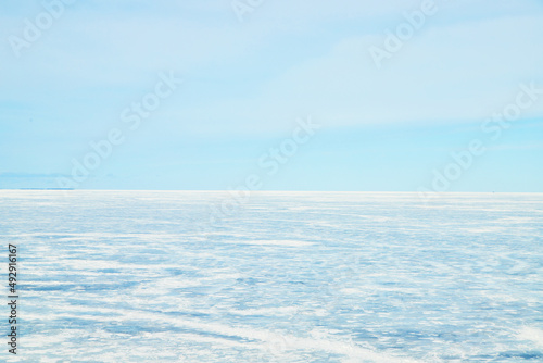View from Mackinaw bridge of frozen lake in winter