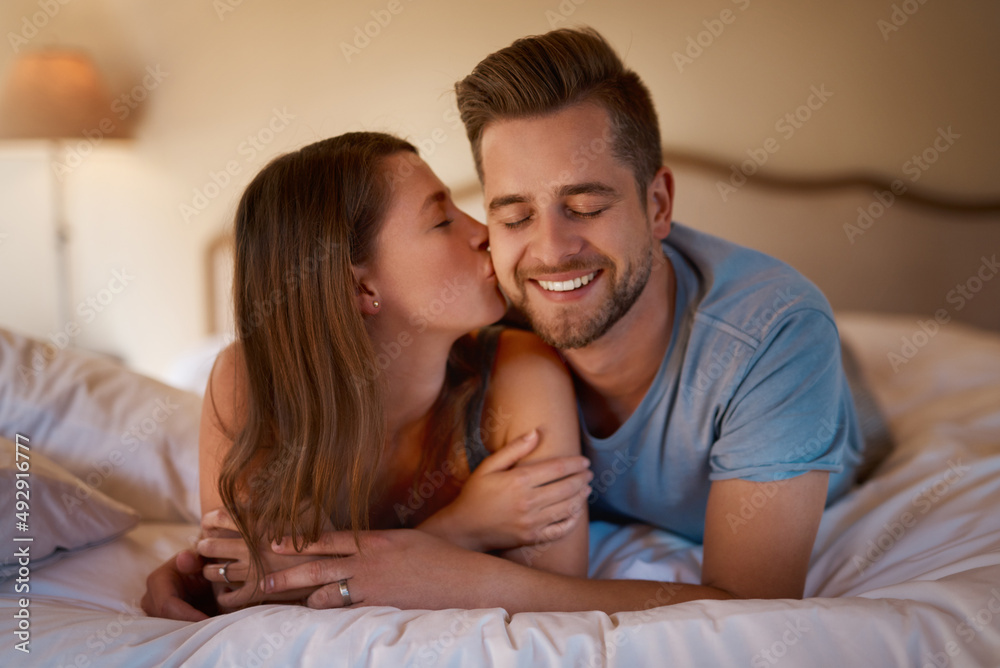 Youre the sweetest person I know. Shot of a loving young couple spending quality time together in their bedroom. Youre the sweetest person I know. Shot of a loving young couple spending quality time together in their bedroom.