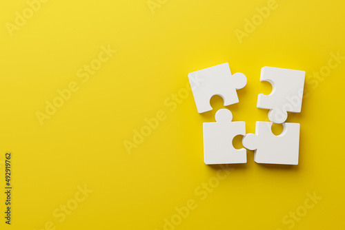 Jigsaw puzzle connecting together. Team business success partnership or teamwork concept. 3d rendering illustration photo