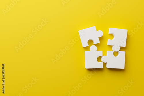 Jigsaw puzzle connecting together. Team business success partnership or teamwork concept. 3d rendering illustration