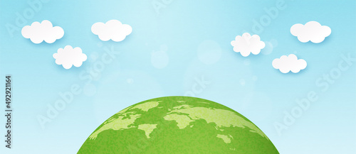 3d Paper art abstract template background.Green earth with clouds on blue sky.