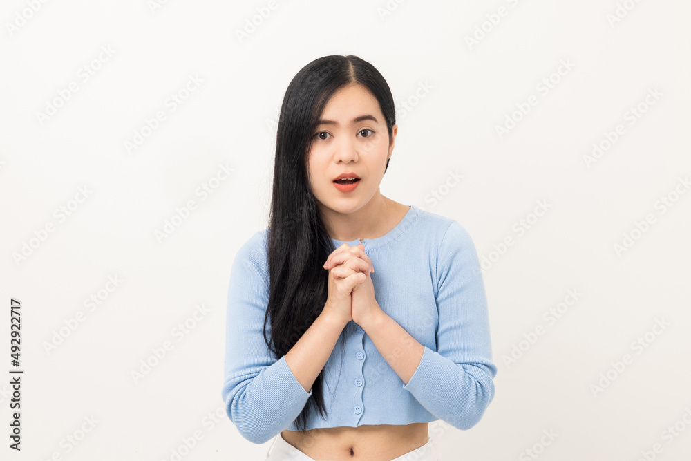 Portrait of Young beautiful Asian woman standing and smiling isolated on white background. Cheerful female age around 20 wearing a blue shirt Looking at camera in white studio Portrait of Young beautiful Asian woman standing and smiling isolated on white background. Cheerful female age around 20 wearing a blue shirt Looking at camera in white studio