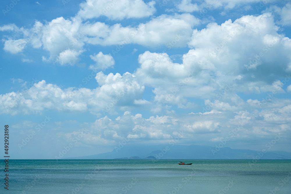 Kep, Cambodia - February 2022: Fishing boat on Kep beach on February 15, 2022 in Kep, Cambodia.