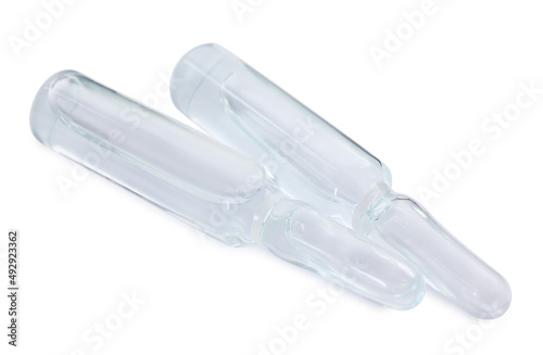 Glass ampoules with pharmaceutical product on white background