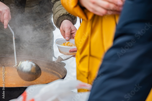 Фотография feeding homeless military refugees who fled their homes during the bombing of ci