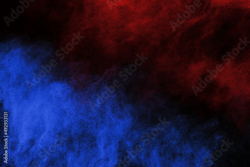 Blue and Red color powder explosion on black background. Colored cloud. Colorful dust explode. Paint Holi.