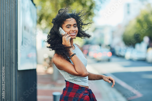 I cant get through the city without my cellphone. Shot of an attractive young woman on a call in the city. © Nola V/peopleimages.com