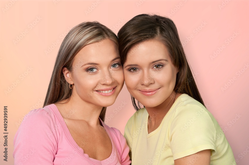 Сheerful young women looking at smiling. Natural Beauties with fresh and clean skin Сheerful young women looking at smiling. Natural Beauties with fresh and clean skin