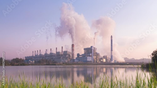 Time lapse video 4K motion, Industrial landscape, coal-fired power plants smoke, industrial pollution causes atmospheric pollution and environmental problems, eco industrial scene.