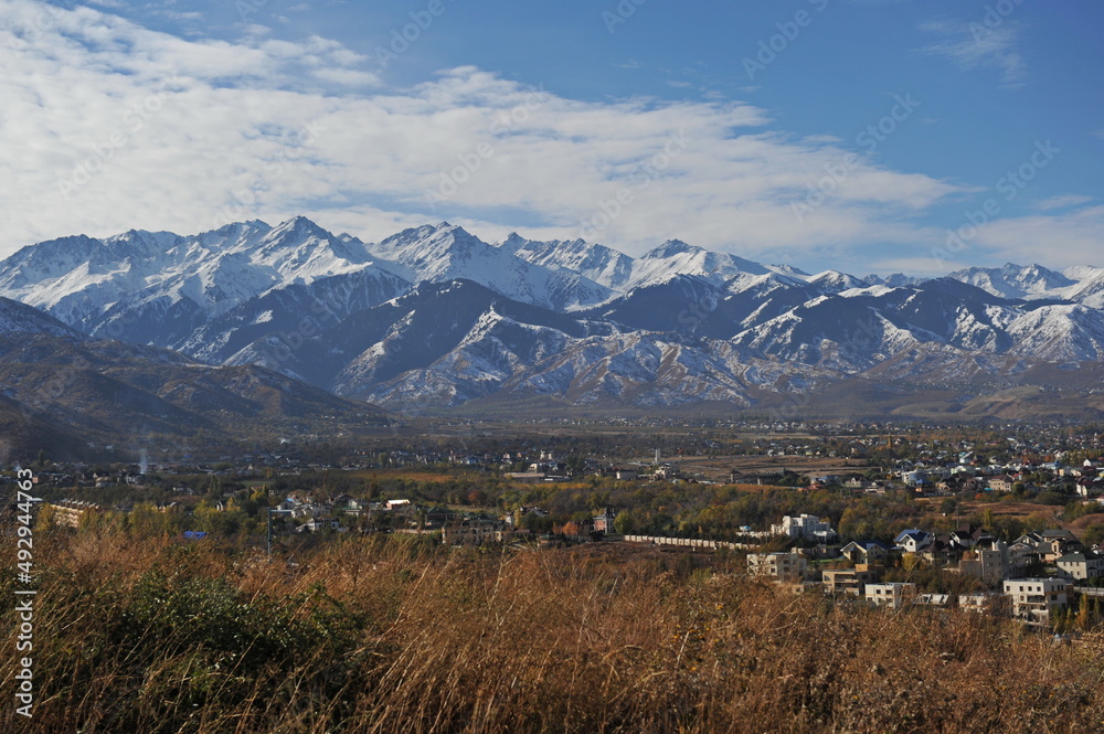 Almaty, Kazakhstan - 10.19.2012 : Residential buildings and commercial buildings located in the city center at the foot of the mountains. Almaty, Kazakhstan - 10.19.2012 : Residential buildings and commercial buildings located in the city center at the foot of the mountains.
