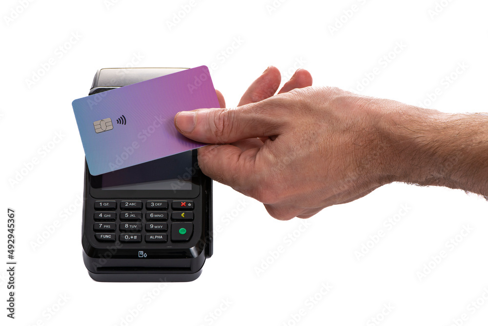 Attached plastic card to the payment terminal with a man's hand on a white isolated background Attached plastic card to the payment terminal with a man's hand on a white isolated background