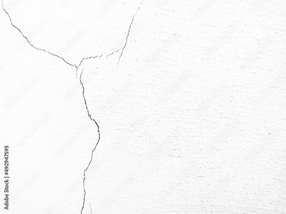Cracked white wall, concrete wall texture, crack background. Cracked white wall, concrete wall texture, crack background.