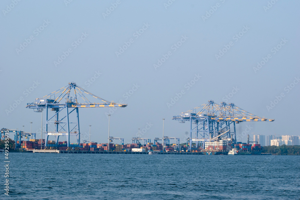 A picture of Container ship terminal Unloading and quay crane of container ship at industrial port with shipping container vessel, Maritime cargo freight ship import export business logistic transport