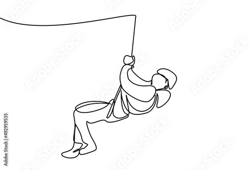 a woman extreme sport rope climbing and trying to cross the road