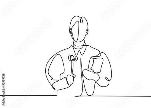 A female lawyer and prosecutor in business suits holding a justice law book and gavel.