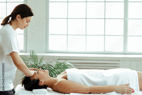 Wallpaper Mural Young woman making massage at spa center Torontodigital.ca