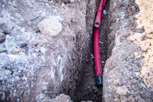 Electrical communications. Excavated trench, earthworks and construction