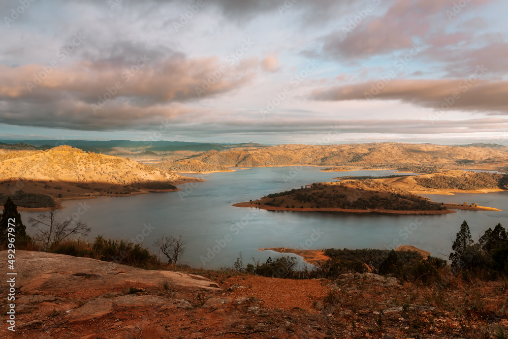 Sunlight across the hills and lake in country NSW Australia