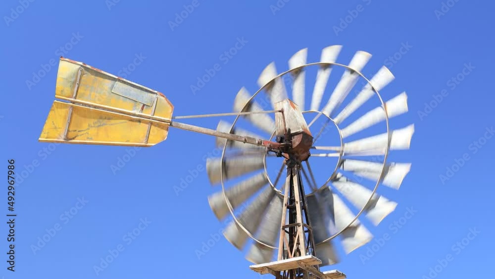 An old windmill turning in the wind in country South Australia