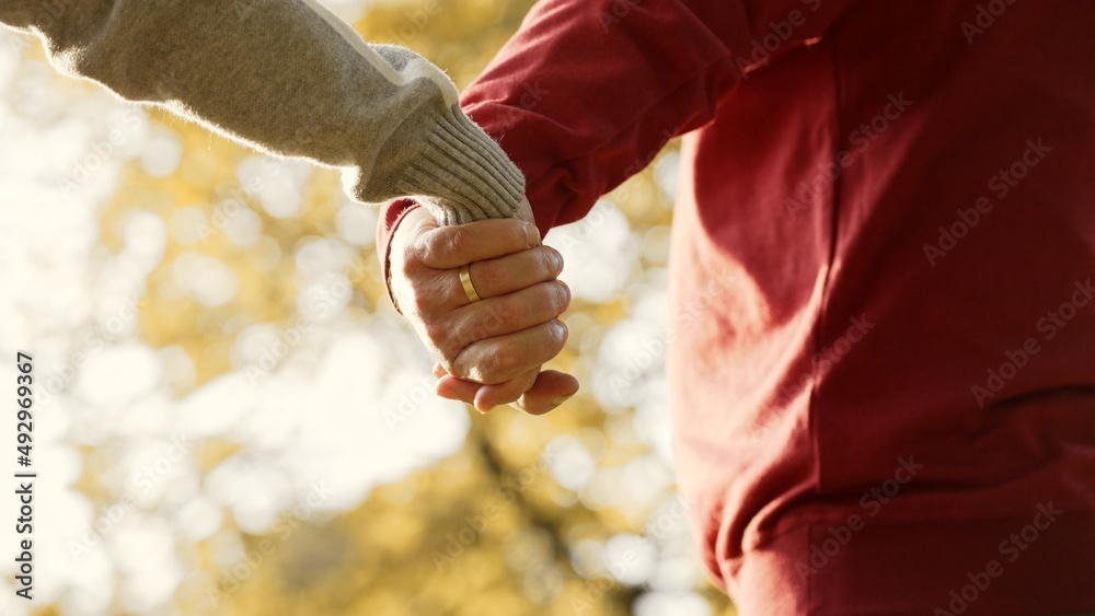 Married senior Caucasian people joining hands closeup selective focus . High quality 4k footage