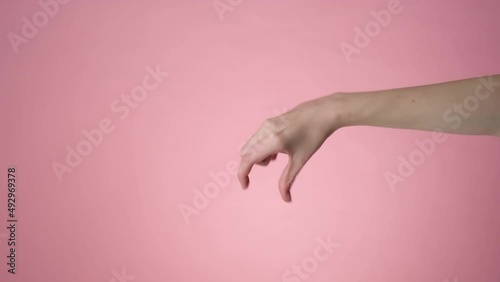 Hand gripping a something small