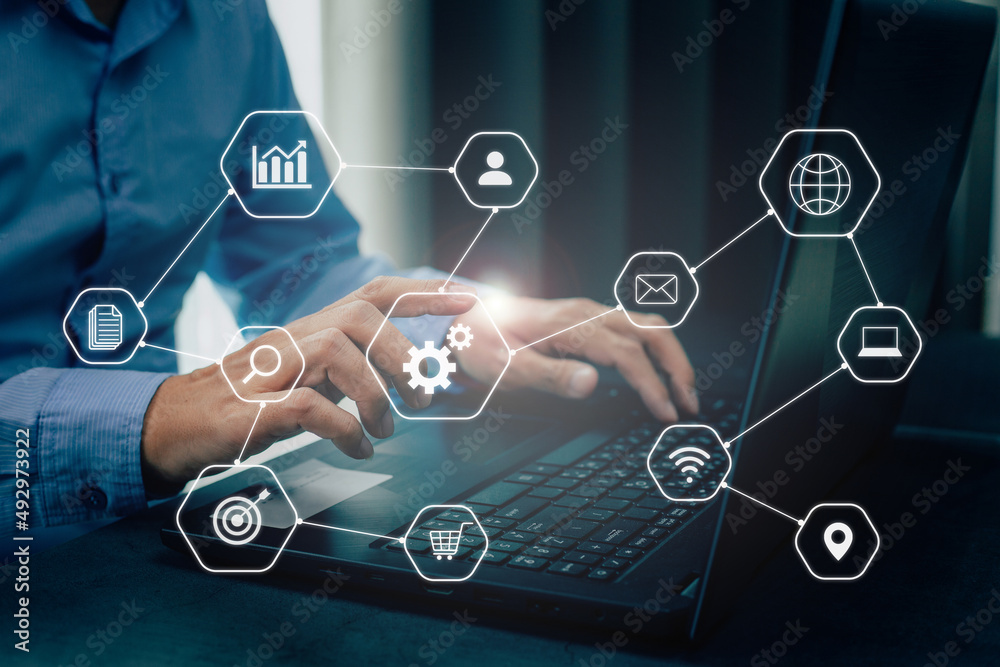 Businessman working remotely at office, modern interface payments online shopping and icon customer network connection. Businessman working remotely at office, modern interface payments online shopping and icon customer network connection.