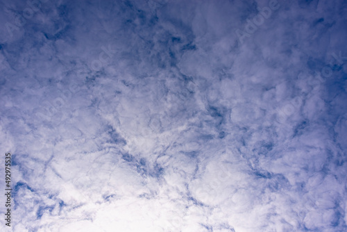Dense clouds in the blue sky.