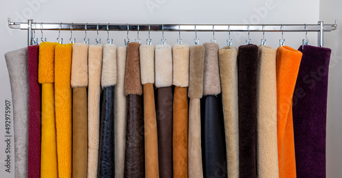 Leather fabrics obtained from natural animals, not yet processed. colored leather pieces hanging