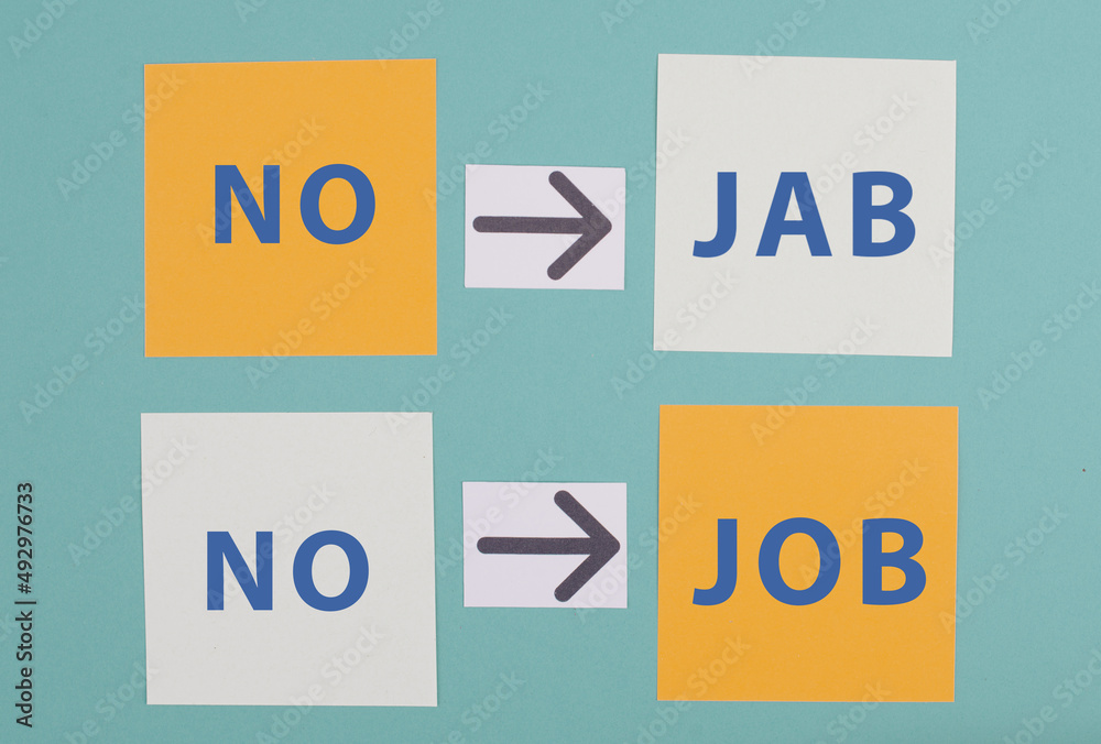 Paper wih the words no jab, no job, mandatory syringe for covid-19, employee termination for anti vaccine Paper wih the words no jab, no job, mandatory syringe for covid-19, employee termination for anti vaccine