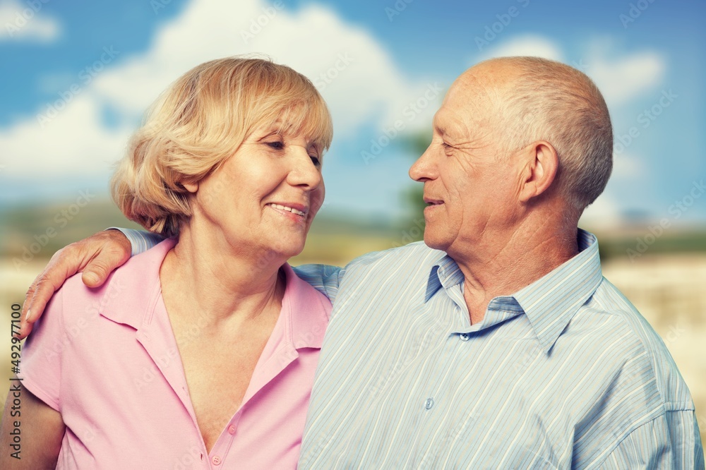 Happy active senior couple outdoors posing Happy active senior couple outdoors posing