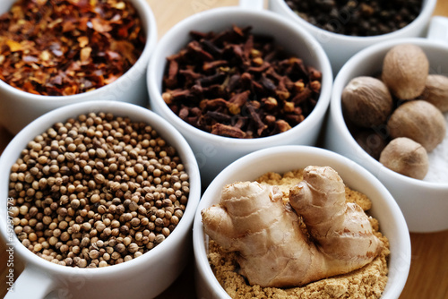Trikatu spices and herbs: ginger, nutmeg, coriander, black, cayenne pepper, cloves. Ayurvedic tradition.