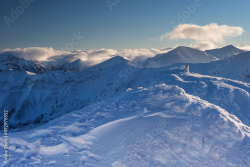 Beautiful winter views of the High Tatra Mountains with tourists, skiers and amazing states of nature  © reme80