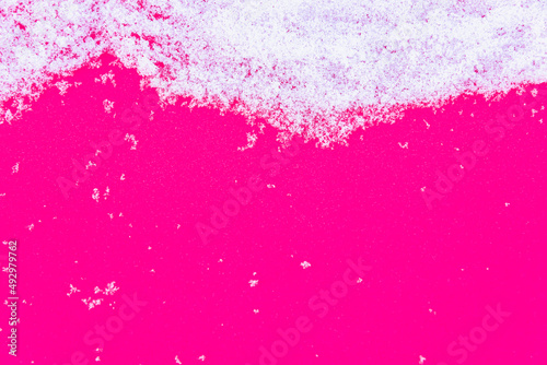 Fluffy white snow and pink background (copy space).