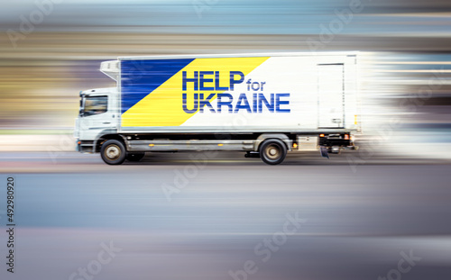 A lorry in motion with the words 