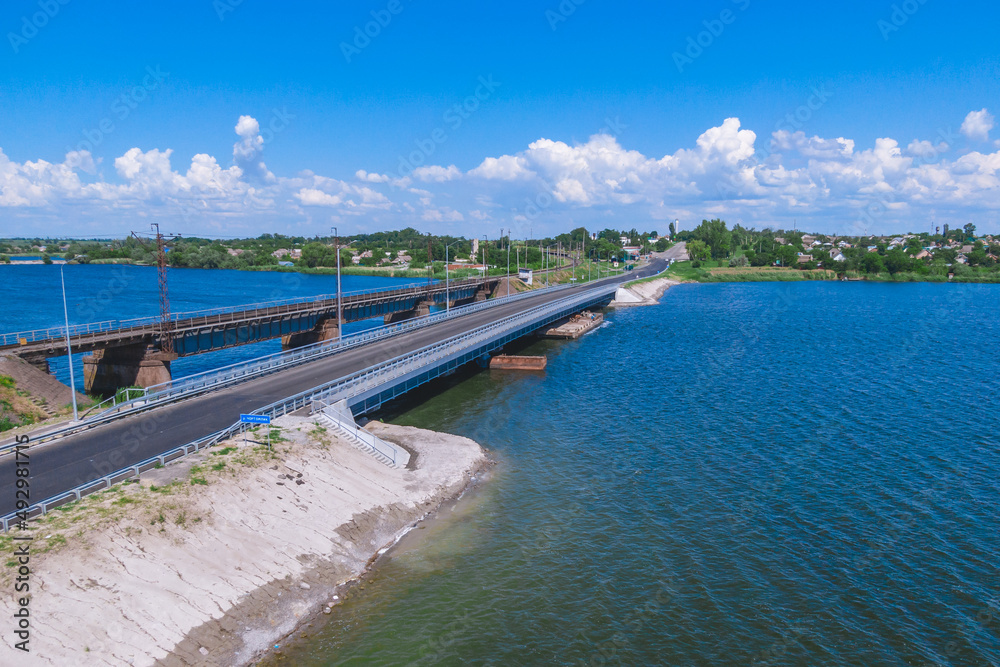 Nikopol. Ukraine. Alekseevsky bridge from a drone. Repaired bridge after destruction. Nikopol. Ukraine. Alekseevsky bridge from a drone. Repaired bridge after destruction.