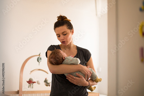 New Mum trying to get her baby to sleep photo