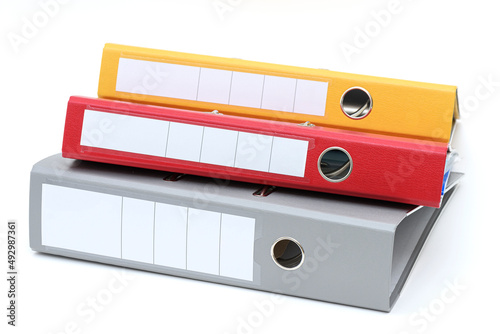 Yellow, red and gray office folder on white background.