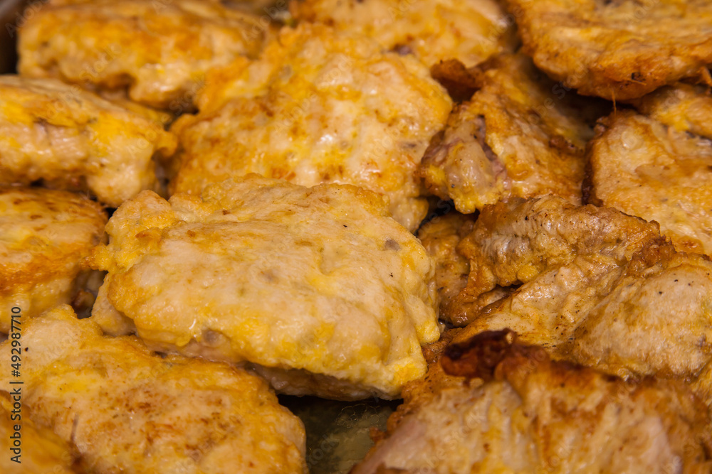 Grilled meat chops in egg batter close-up. Grilled meat chops in egg batter close-up.