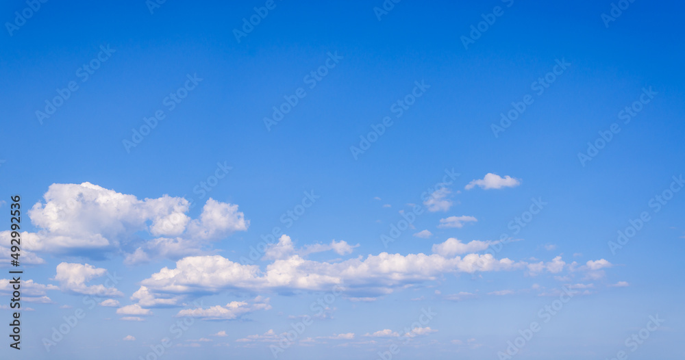 Panorama of blue sky with white cumulus clouds Panorama of blue sky with white cumulus clouds