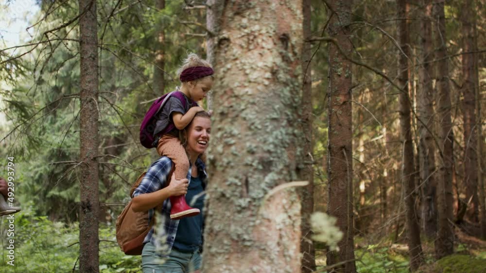 Family with small children walking outdoors in summer nature. Family with small children walking outdoors in summer nature.