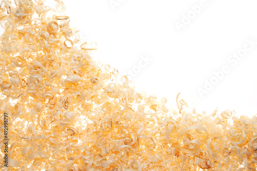 Sawdust on a white isolated background top view with place for text or inscription. Wood dust texture. Sawdust pattern close up background pattern.